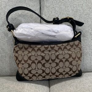Signature Coach tan/brown bag with gold hardware